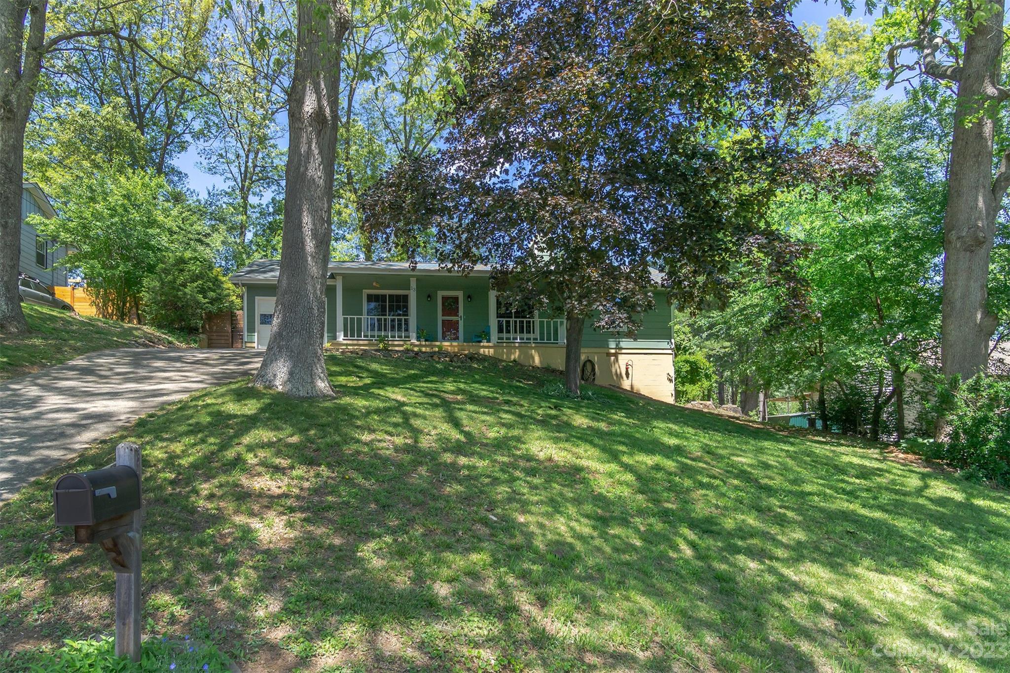 13 Woodfield Road Arden, NC 28704 - Photo 40 of 41 a view of a house with a backyard