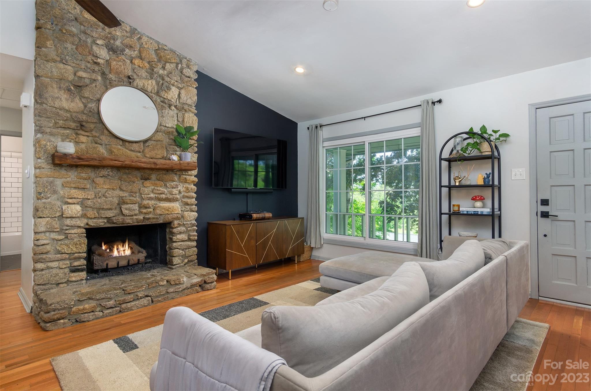 13 Woodfield Road Arden, NC 28704 - Photo 6 of 41 a living room with furniture and a fireplace