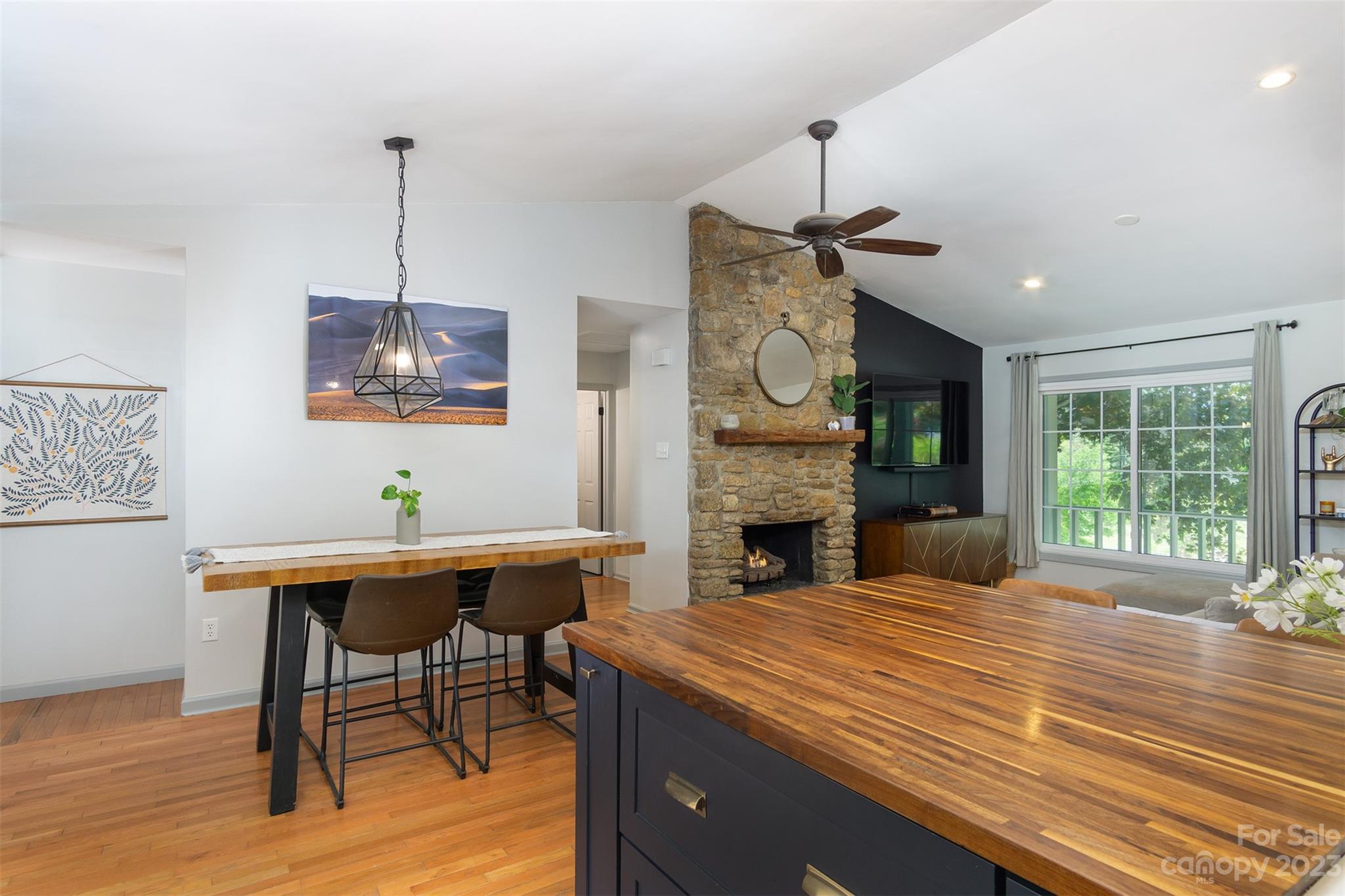 13 Woodfield Road Arden, NC 28704 - Photo 8 of 41 a view of a dining room with furniture window and wooden floor
