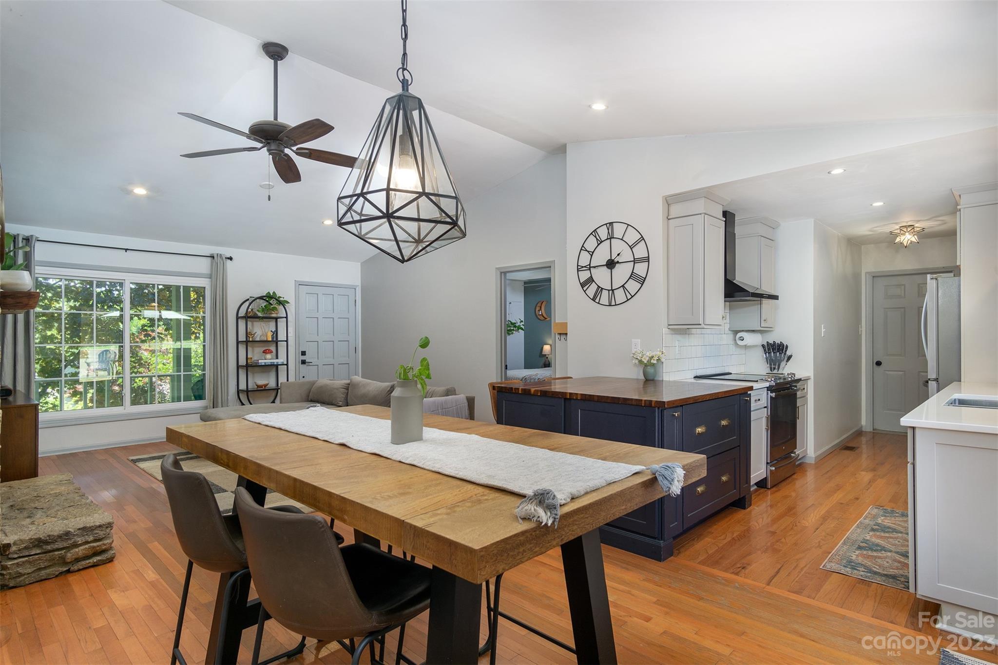13 Woodfield Road Arden, NC 28704 - Photo 10 of 41 a view of a dining room with furniture window and wooden floor