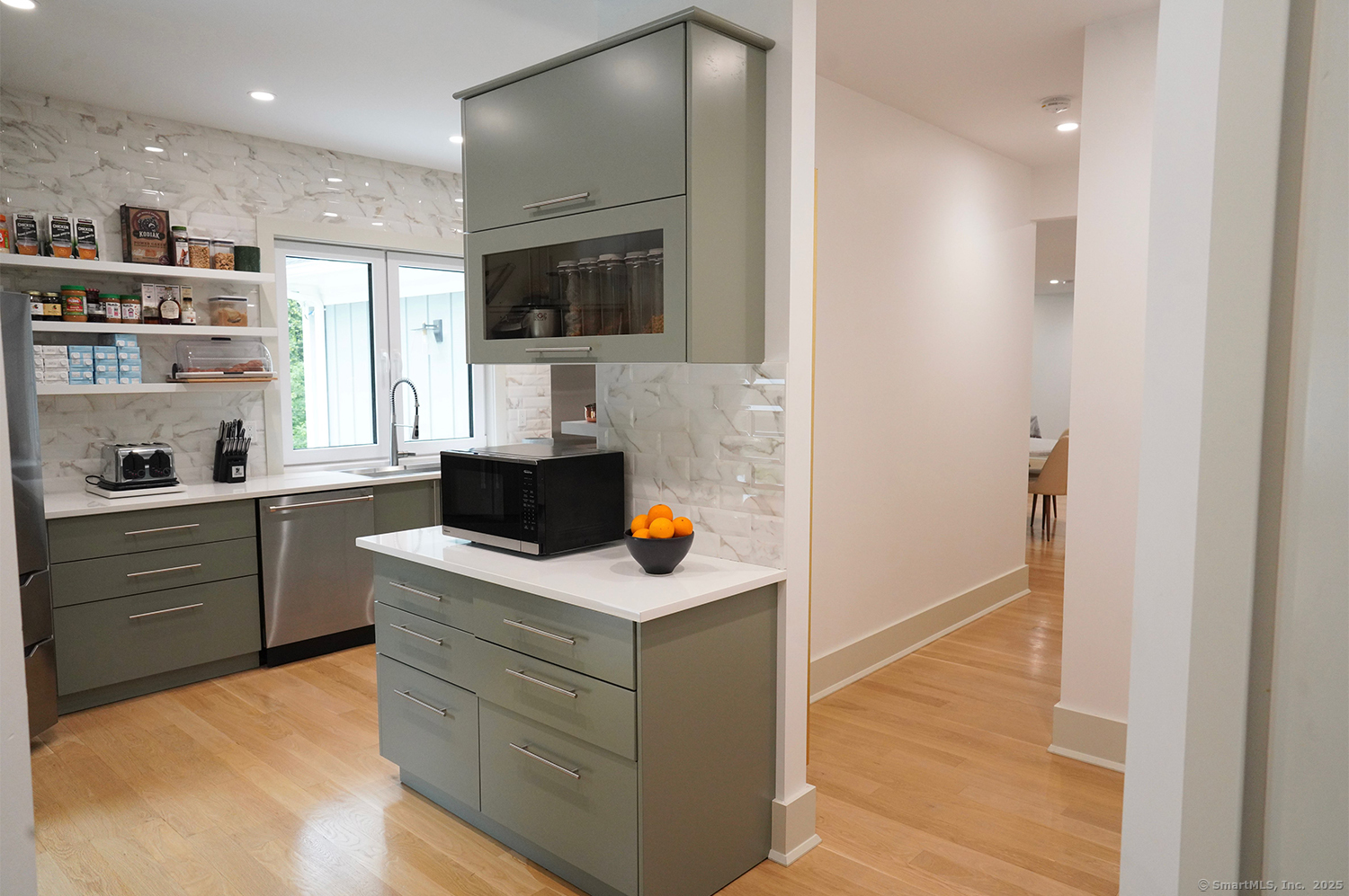 9 Grey Fox Lane Weston, CT 06883 - Photo 11 of 37 a kitchen with stainless steel appliances a stove microwave and white cabinets