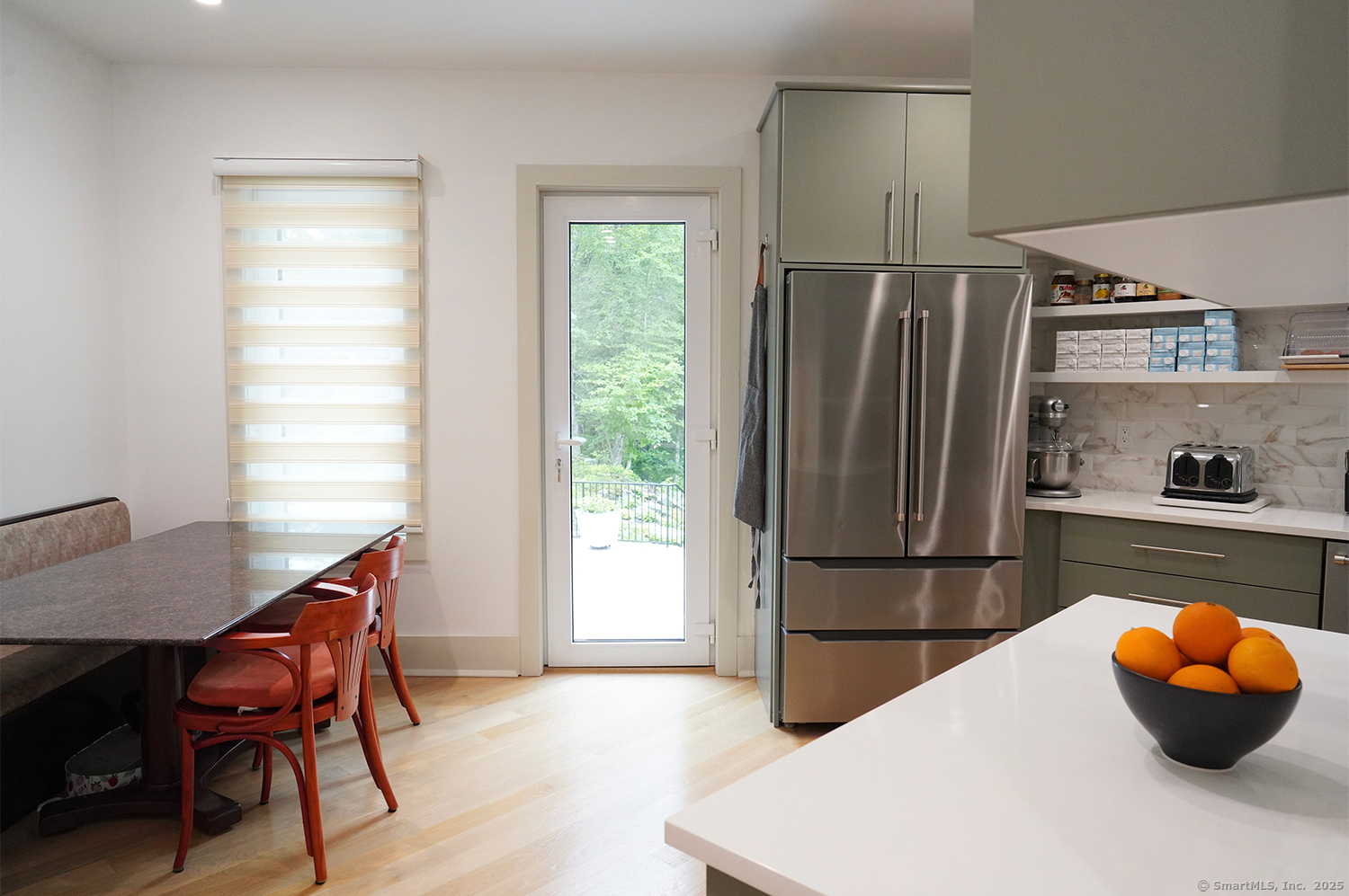 9 Grey Fox Lane Weston, CT 06883 - Photo 12 of 37 a kitchen with a refrigerator and wooden floor