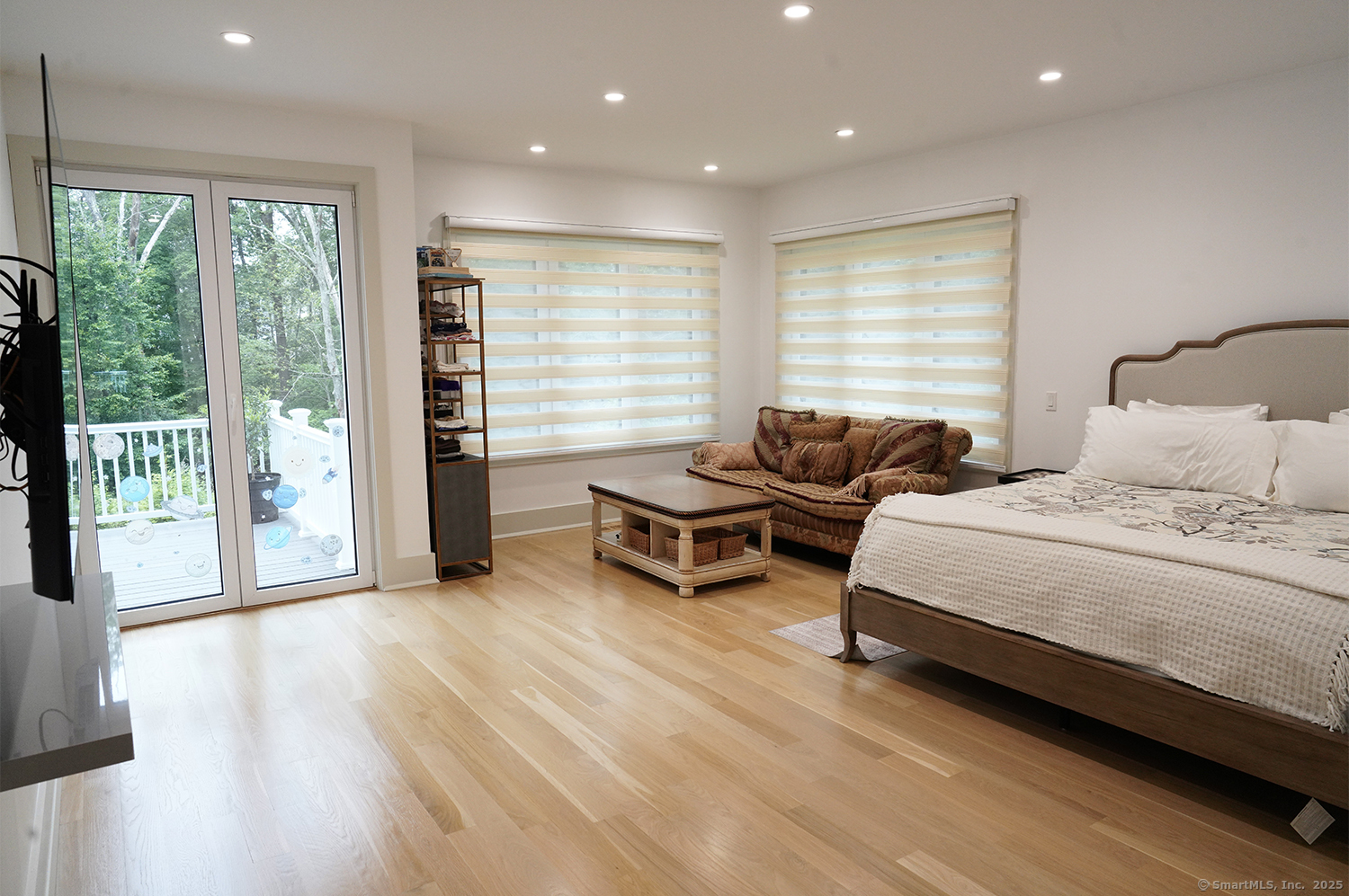 9 Grey Fox Lane Weston, CT 06883 - Photo 16 of 37 a spacious bedroom with a bed and a couch