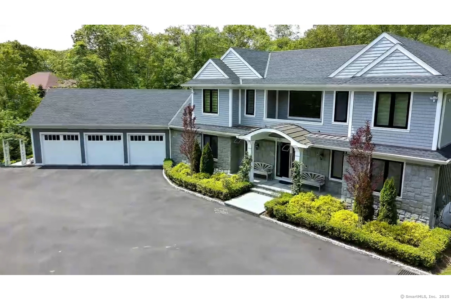 9 Grey Fox Lane Weston, CT 06883 - Photo 2 of 37 a front view of a house with garden