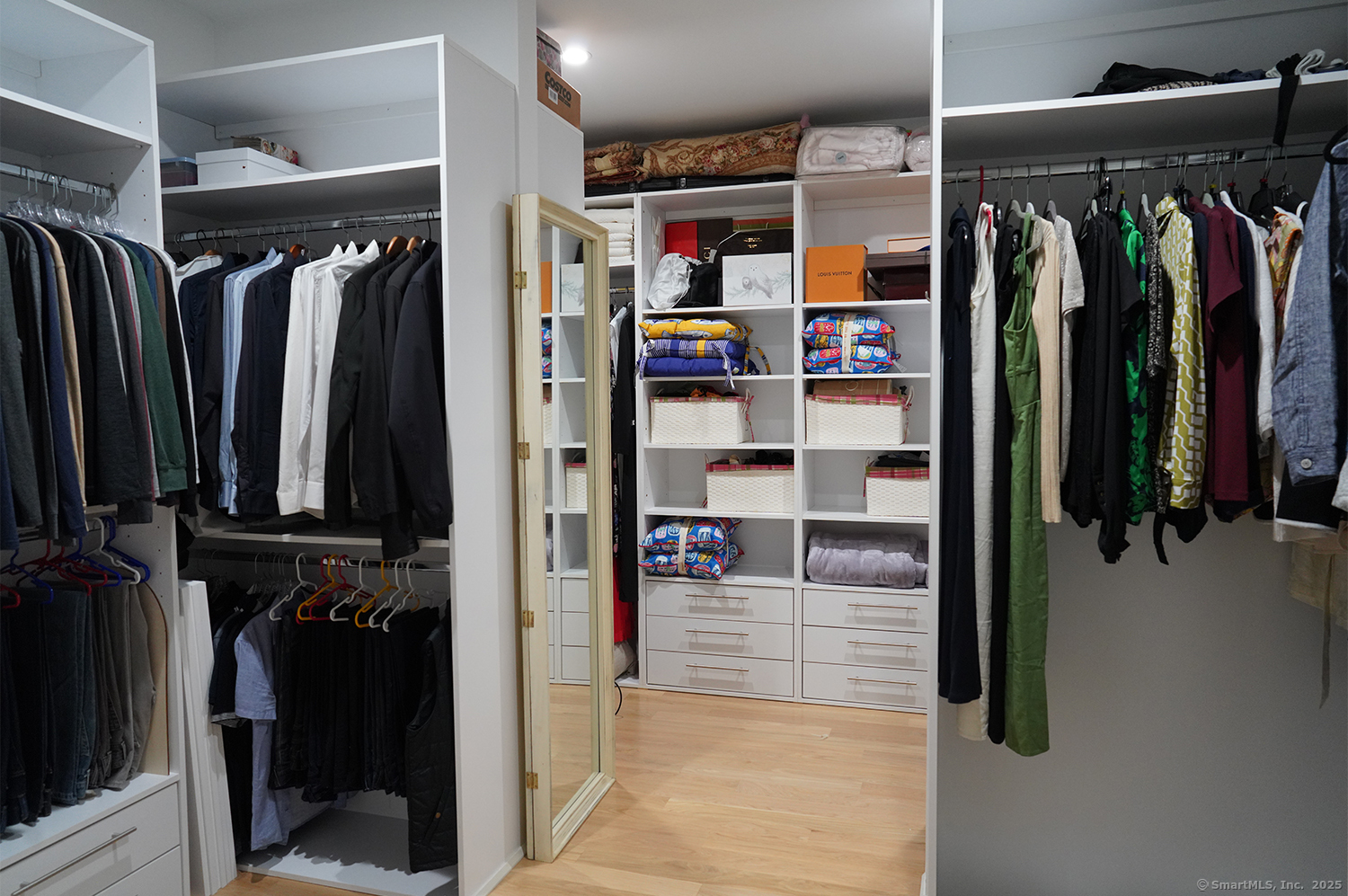 9 Grey Fox Lane Weston, CT 06883 - Photo 21 of 37 a view of walk in closet with clothes and shoes
