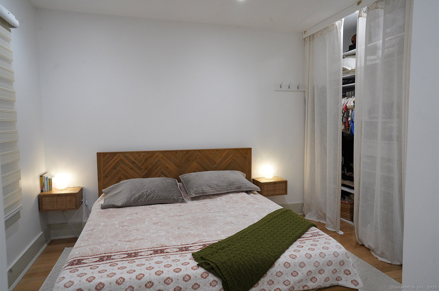 9 Grey Fox Lane Weston, CT 06883 - Photo 22 of 37 a bedroom with a bed and a lamp