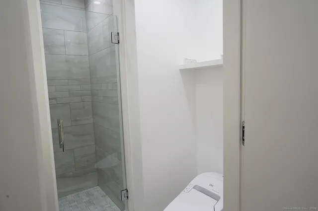 a bathroom with a sink vanity and a mirror