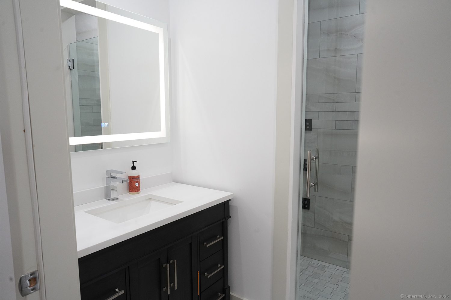 9 Grey Fox Lane Weston, CT 06883 - Photo 25 of 37 a bathroom with a sink vanity and a mirror