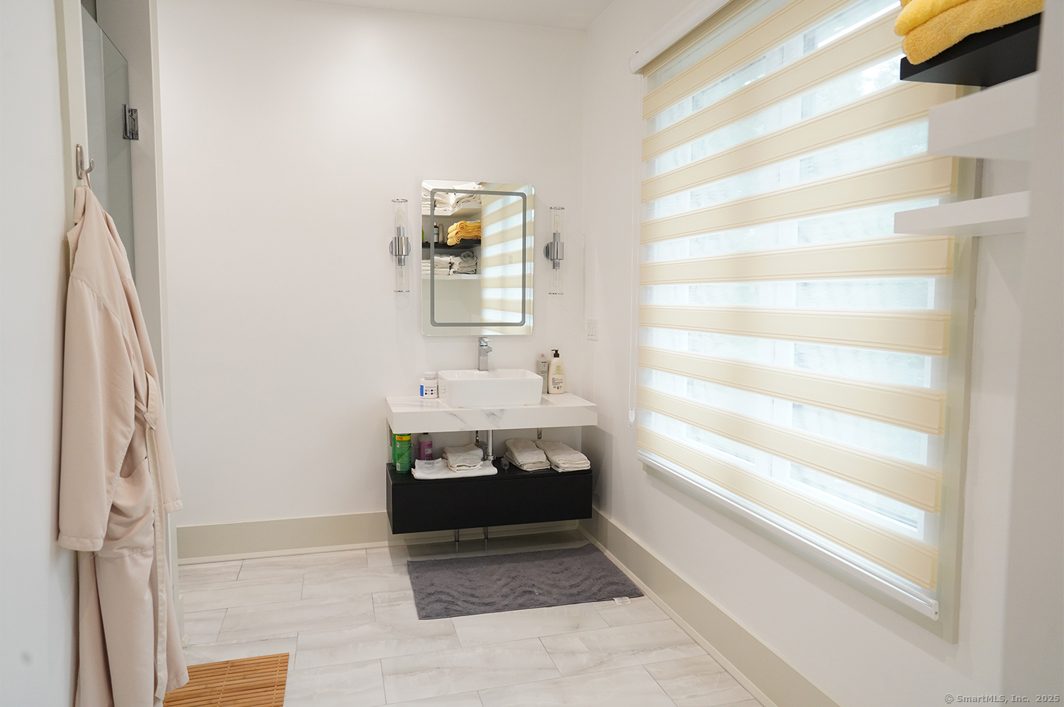 9 Grey Fox Lane Weston, CT 06883 - Photo 30 of 37 a bathroom with a sink and a mirror