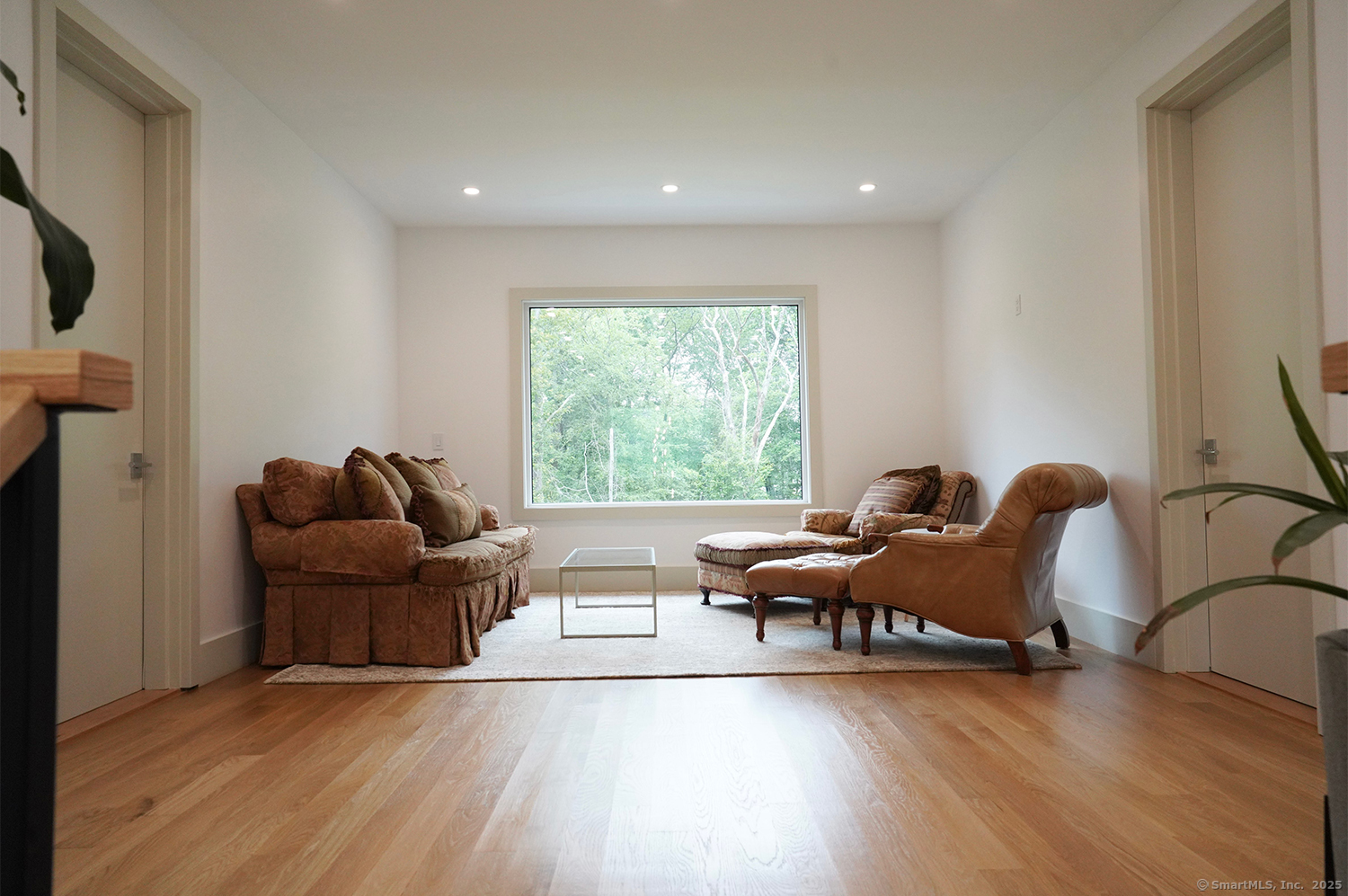 9 Grey Fox Lane Weston, CT 06883 - Photo 33 of 37 a living room with furniture and a large window