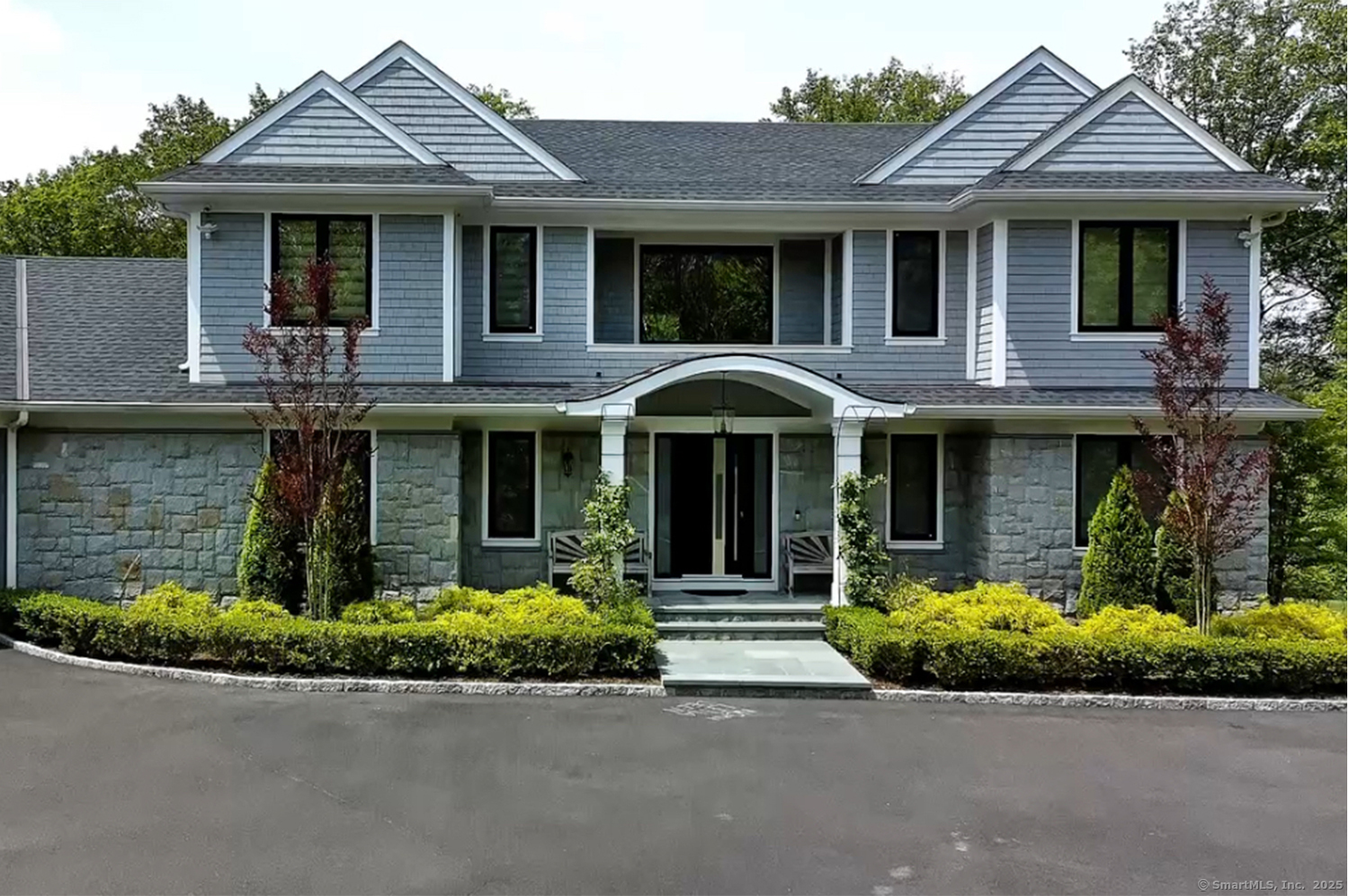 9 Grey Fox Lane Weston, CT 06883 - Photo 4 of 37 a front view of a house with garden