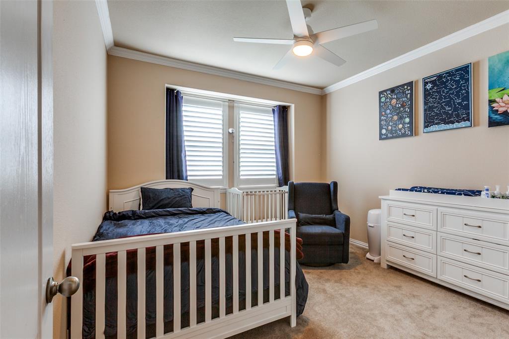 628 Raford Hill Lane Richardson, TX 75081 - Photo 25 of 34 a bedroom with furniture and a window