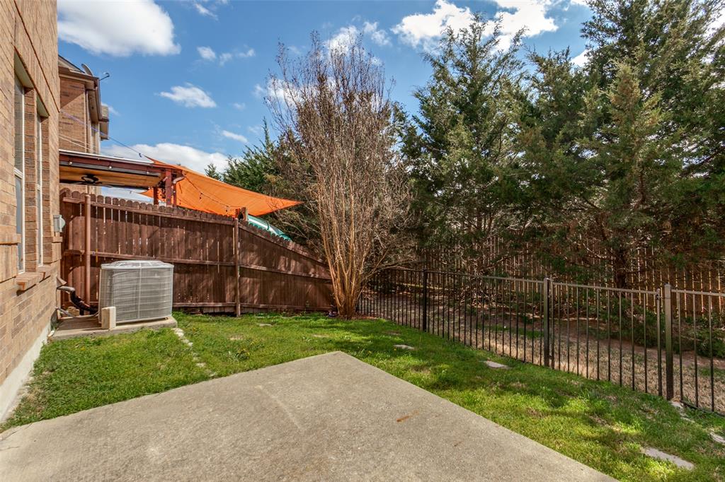 628 Raford Hill Lane Richardson, TX 75081 - Photo 27 of 34 a view of a house with a yard
