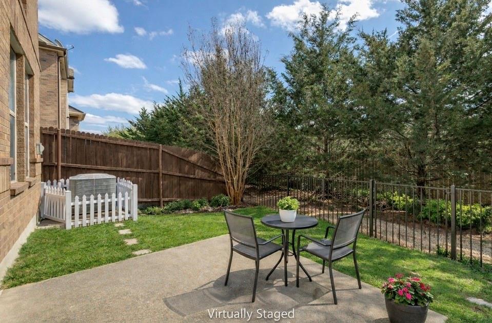 628 Raford Hill Lane Richardson, TX 75081 - Photo 28 of 34 a view of a chairs and table in backyard of the house