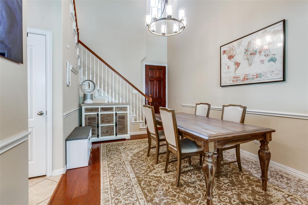 628 Raford Hill Lane Richardson, TX 75081 - Photo 4 of 34 a view of a dining room with furniture and wooden floor