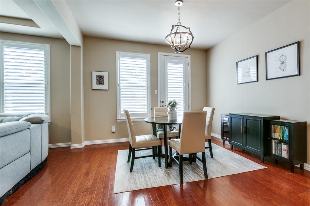 628 Raford Hill Lane Richardson, TX 75081 - Photo 9 of 34 a view of a dining room with furniture window and wooden floor
