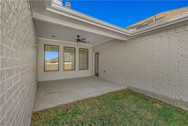 a bathroom with a double vanity sink mirror and shower