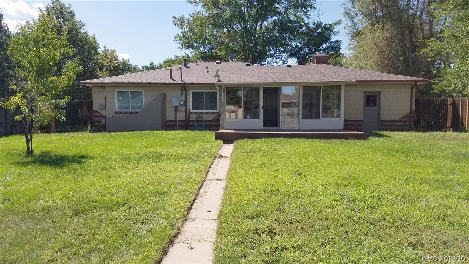 4630 Quay Street Wheat Ridge, CO 80033 - Photo 36 of 36 a front view of a house with a garden