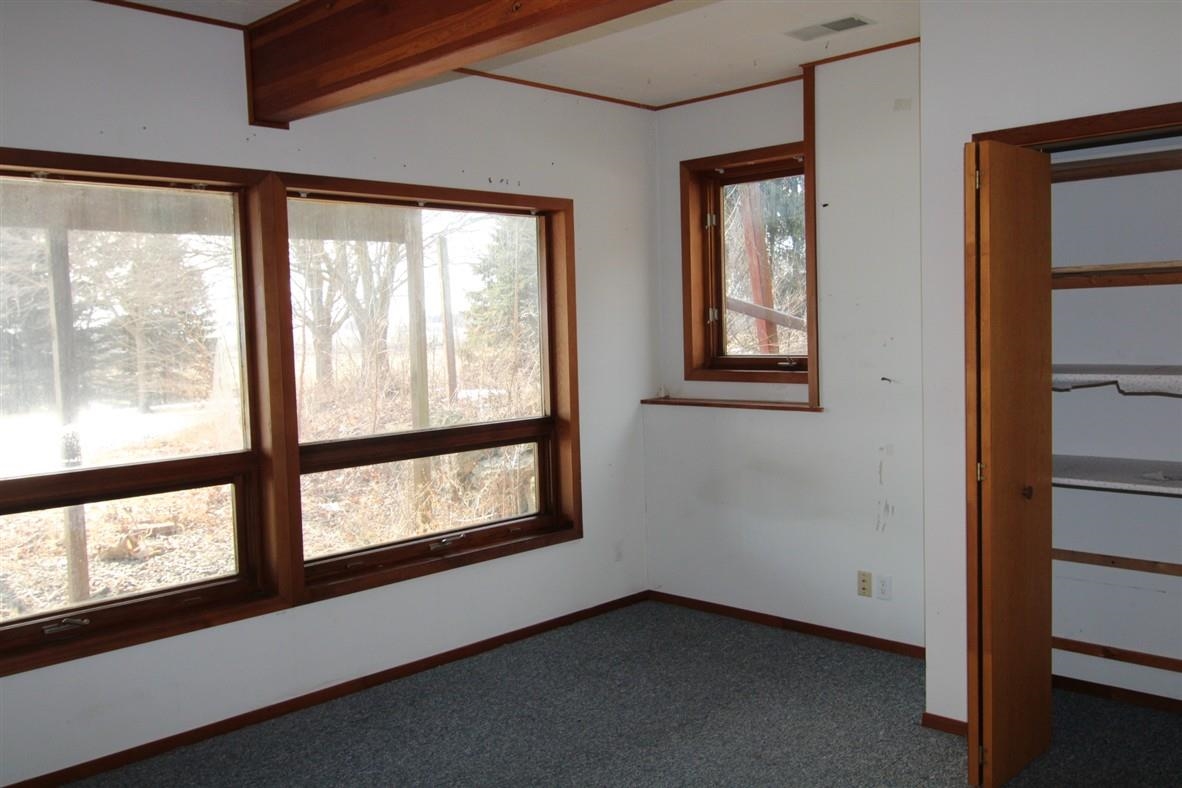 15651 Rock Grove Road Durand, IL 61024 - Photo 14 of 30 a view of an empty room with a window