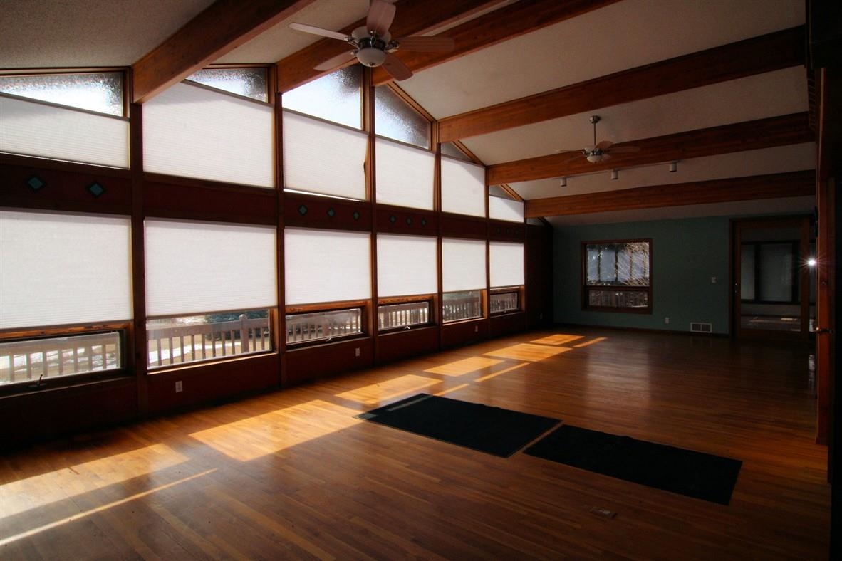 15651 Rock Grove Road Durand, IL 61024 - Photo 19 of 30 a view of an empty room with window and wooden floor