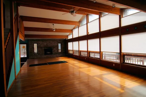 a view of an empty room with a window