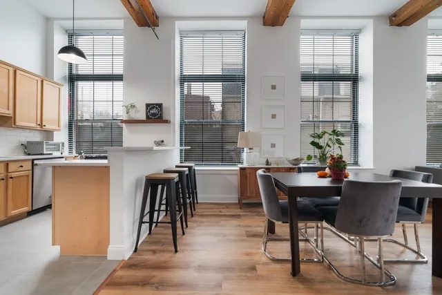 a view of a dining room with furniture and window