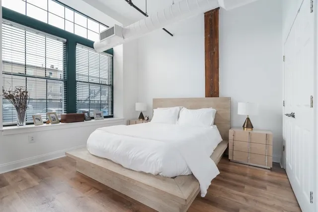 a large white bed in a white room