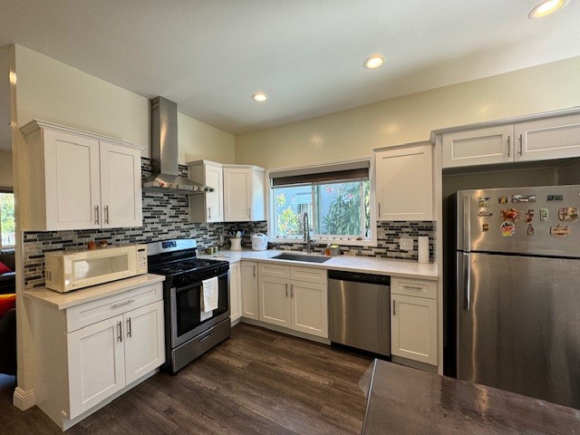 a kitchen with stainless steel appliances granite countertop a stove a refrigerator and a refrigerator