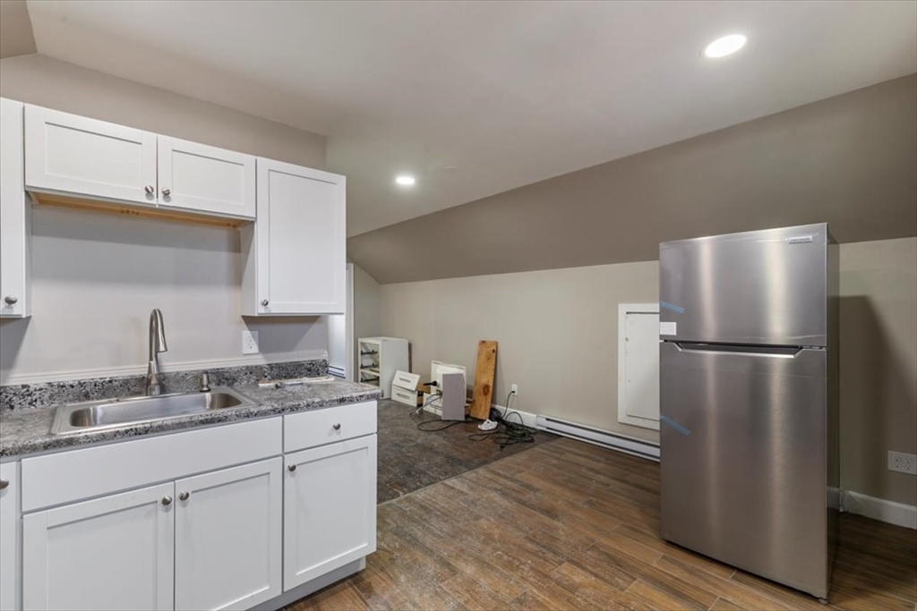 31 Garfield Street Lawrence, MA 01843 - Photo 13 of 31 a kitchen with a refrigerator and a sink