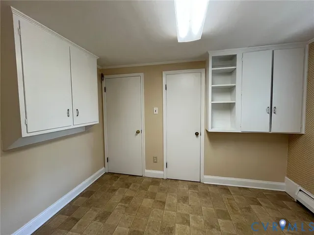 a view of an empty room with closet