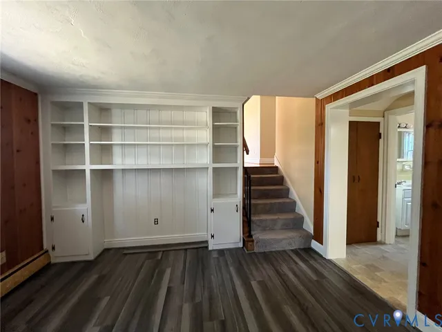 wooden floor in an empty room with a gallery
