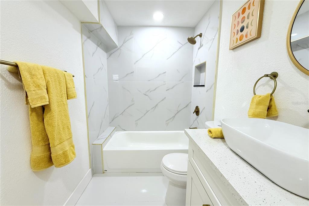 8816 Ashman Road Riverview, FL 33578 - Photo 30 of 52 a bathroom with a sink and bathtub
