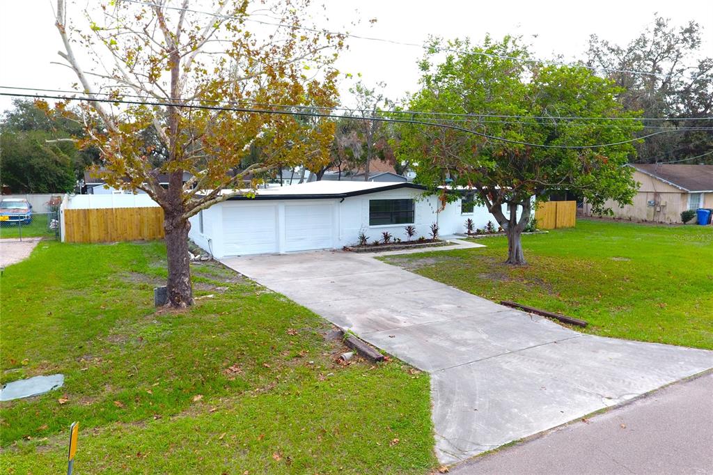 8816 Ashman Road Riverview, FL 33578 - Photo 5 of 52 a view of a house with a yard
