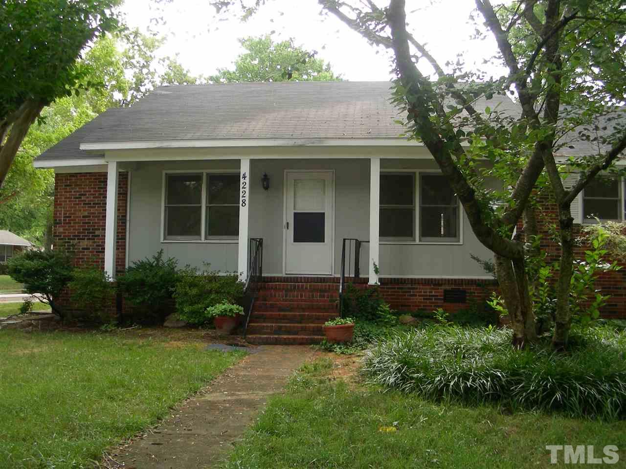 4228 Green Road Raleigh, NC 27604 - Photo 1 of 9 a front view of a house with garden
