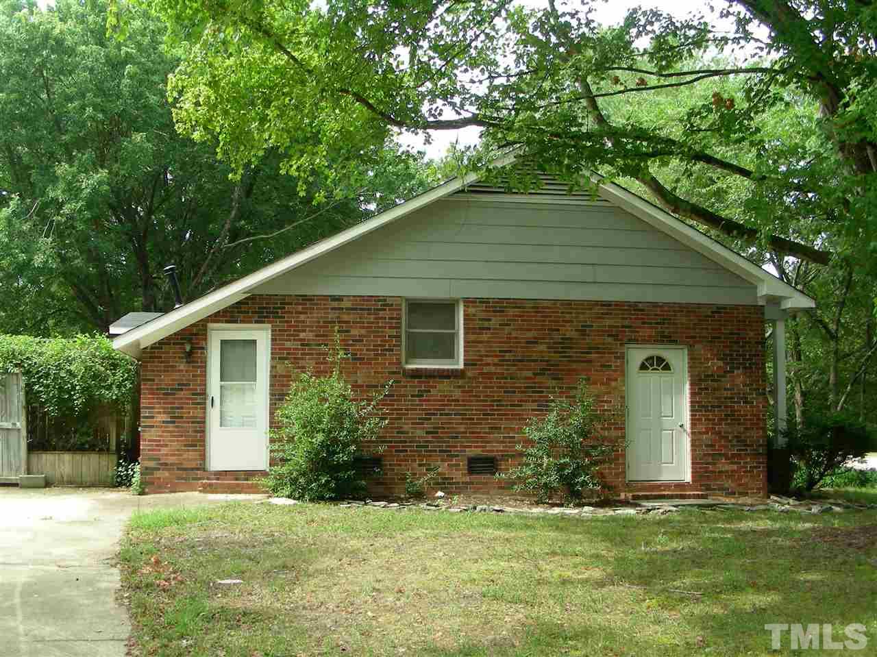 4228 Green Road Raleigh, NC 27604 - Photo 2 of 9 a front view of a house with a garden