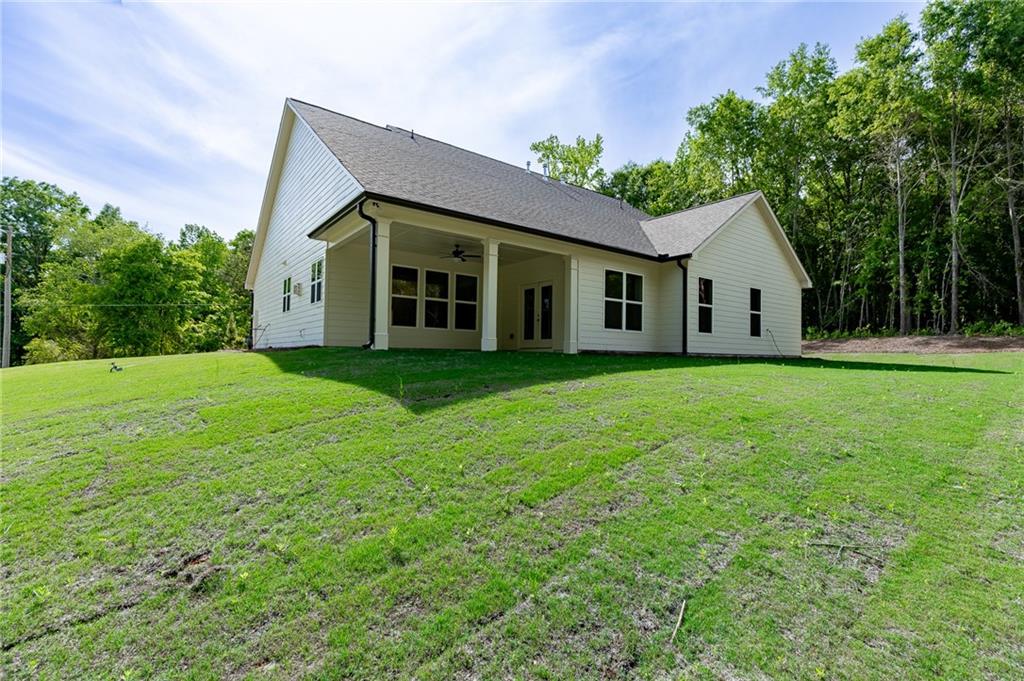 1210 Austin Road Winder, GA 30680 - Photo 50 of 56 a view of a house with a yard and potted plants