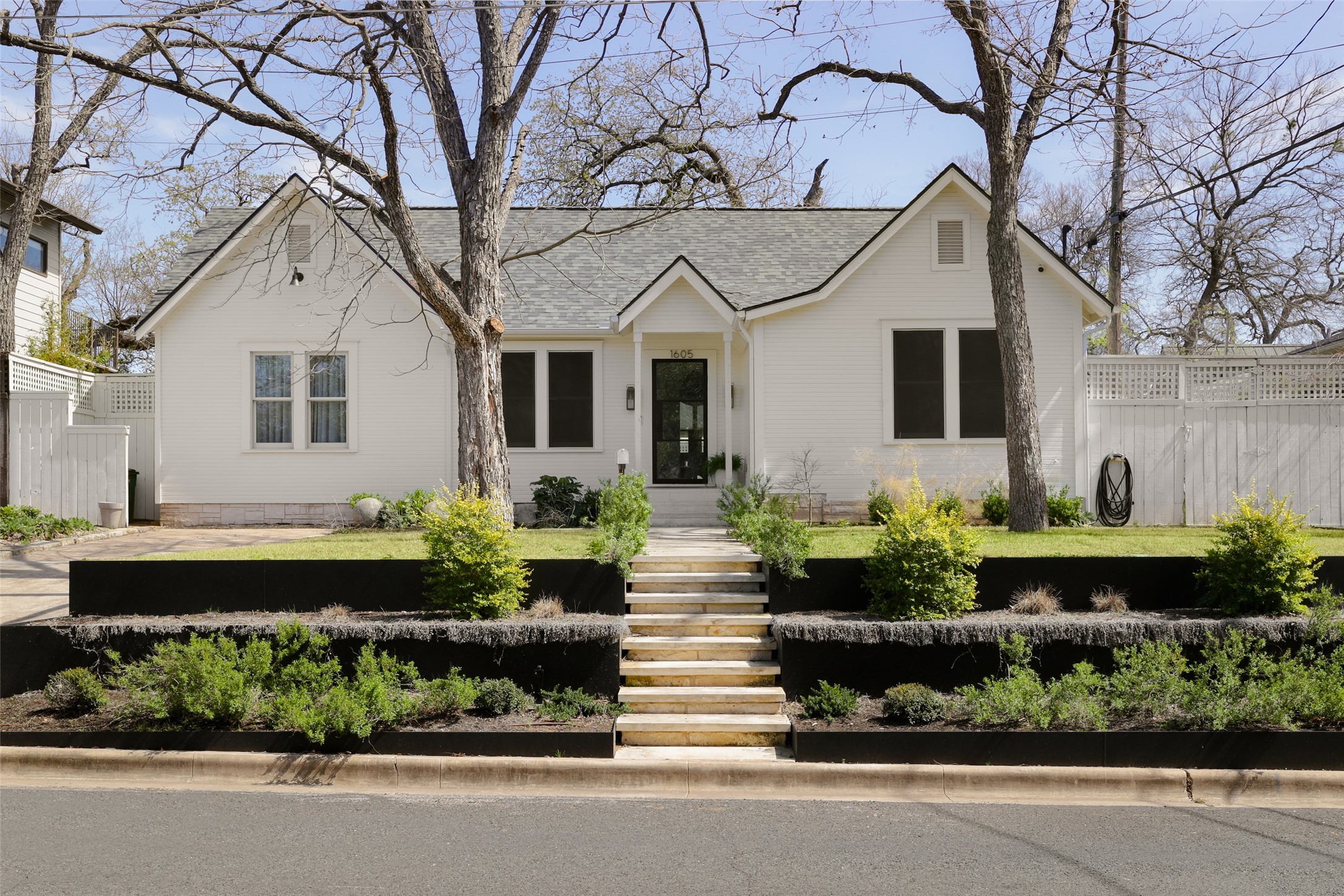1605 Raleigh Avenue Austin, TX 78703 - Photo 1 of 1 a front view of a house with a garden