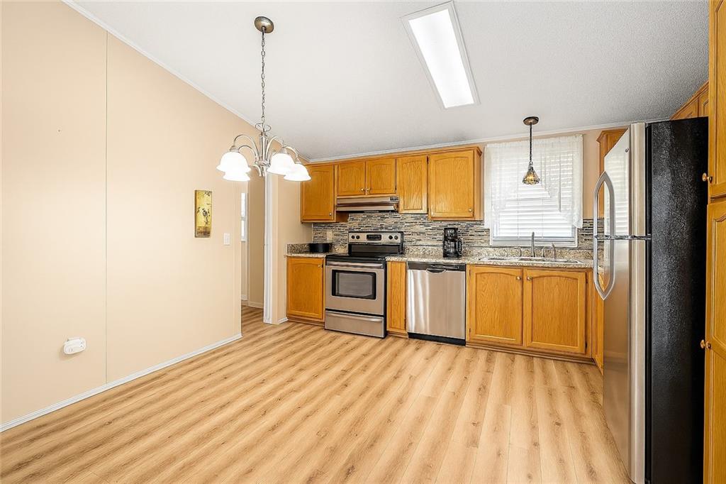 264 Ridge Lane Murrysville, PA 15668 - Photo 3 of 35 Beautiful lightwood flooring, and plenty of space to add a table!