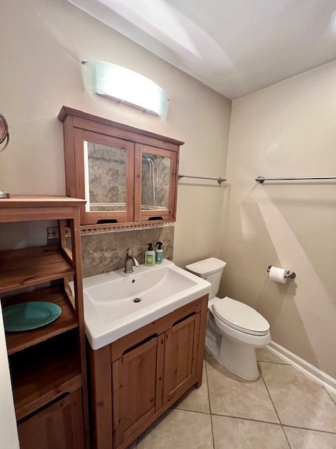 8006 Pinedale Cove Austin, TX 78757 - Photo 16 of 22 a bathroom with a sink a toilet and mirror