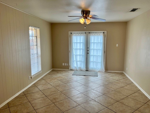 8006 Pinedale Cove Austin, TX 78757 - Photo 4 of 22 an empty room with windows and chandelier fan