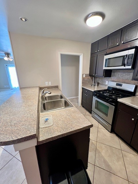 8006 Pinedale Cove Austin, TX 78757 - Photo 7 of 22 a kitchen with a sink a stove and refrigerator