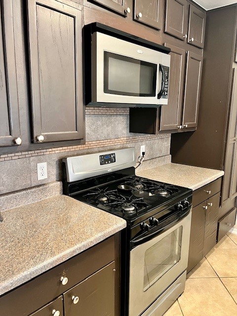 8006 Pinedale Cove Austin, TX 78757 - Photo 8 of 22 a kitchen with granite countertop stainless steel appliances a stove microwave and sink