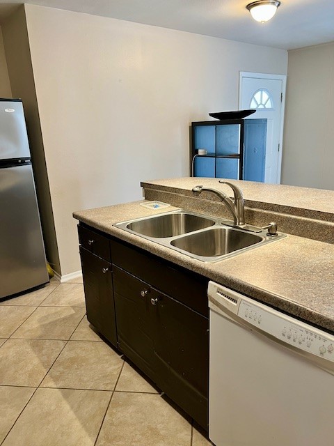 8006 Pinedale Cove Austin, TX 78757 - Photo 9 of 22 a utility room with two sink and a washer dryer