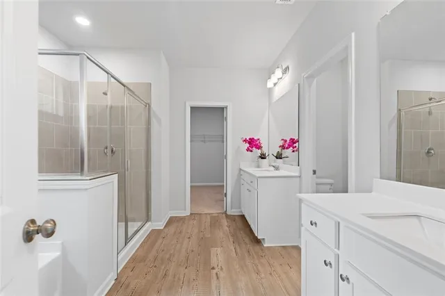 a bathroom with a double vanity sink and mirror