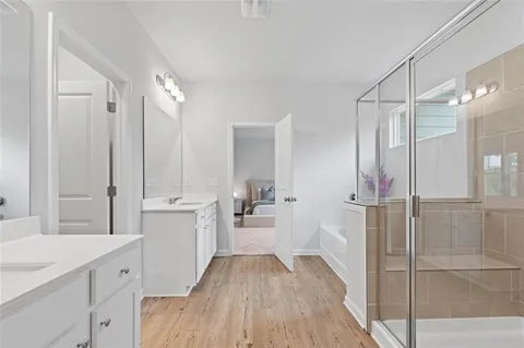a bathroom with a bathtub and a shower