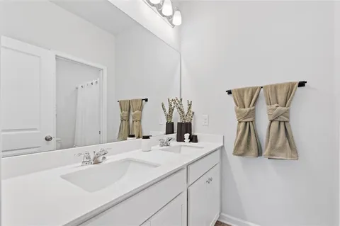 a white toilet sitting next to a white walls