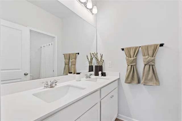 a white toilet sitting next to a white walls