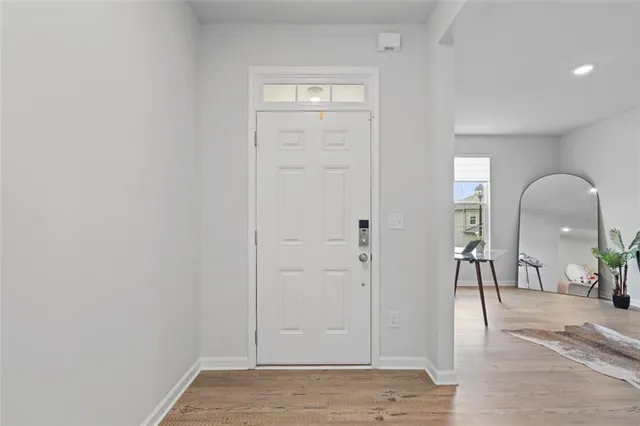 a view of a livingroom with furniture and front door