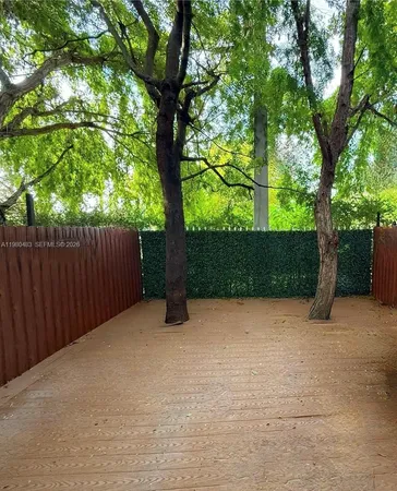 a view of backyard with green space