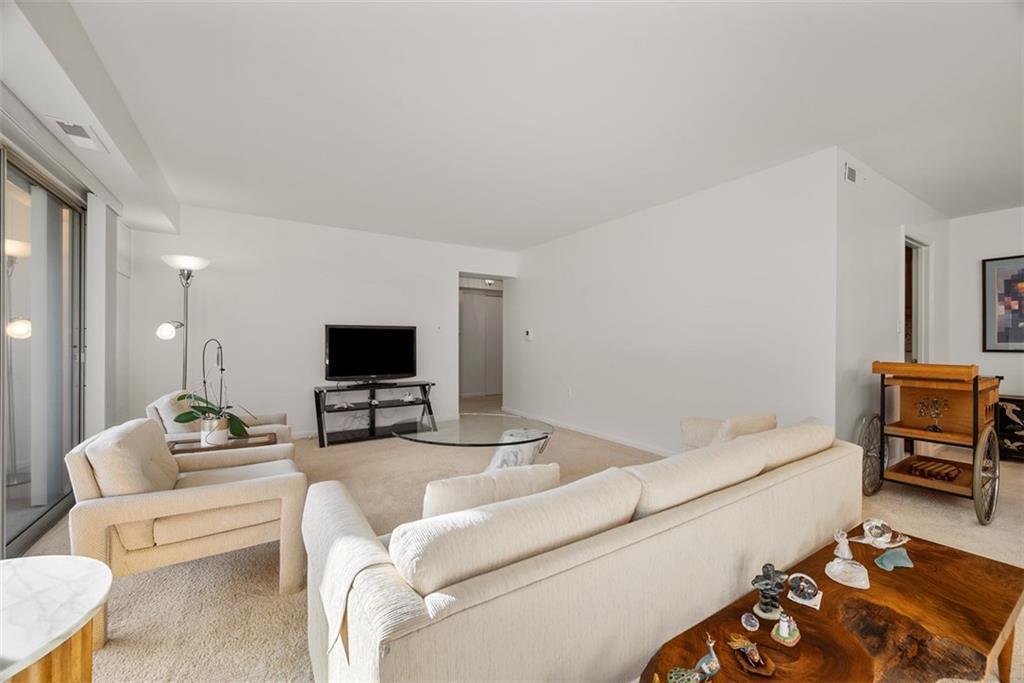 302 Fox Chapel Road, Unit 613 Pittsburgh, PA 15238 - Photo 15 of 37 a living room with furniture and a flat screen tv